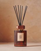 Maison Ormuth reed diffuser on warm plaster